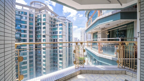 A high-rise building with a modern design, featuring multiple balconies and large windows. - Tyms Xujiahui Elegant 1BR APT  (Shanghai)