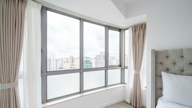 A bedroom with a large window, a bed, and curtains. - Tyms Spacious 3BR 2BA APT  Laishi Di (Shanghai)