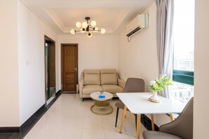 Superior Apartment, 1 Bedroom, Kitchen, City View | Living room | 55-inch Smart TV with cable channels