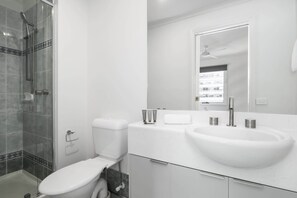 Shower, hair dryer, towels, shampoo