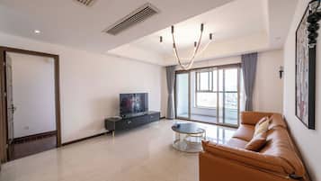 Superior Apartment, 3 Bedrooms, Kitchen, City View | Living room | 55-inch Smart TV with cable channels