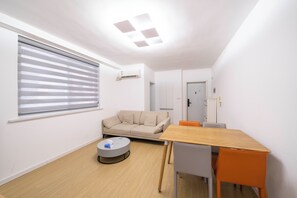 Superior Apartment, Balcony, City View | Living room | 55-inch Smart TV with cable channels