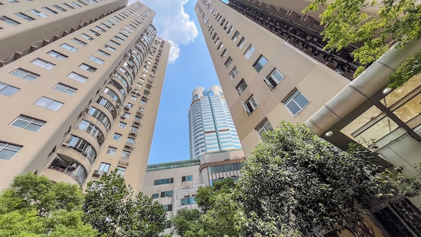 A high-rise building with multiple floors, balconies, and a mix of architectural styles. - Tyms Xujiahui Premium 3BR 2BA APT  (Shanghai)