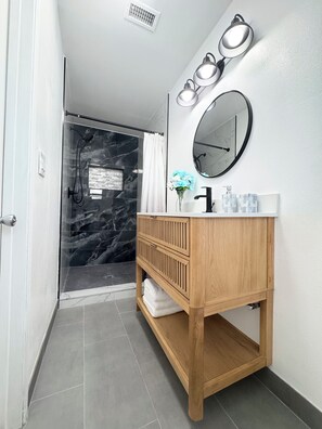 Shower, hair dryer, towels, soap