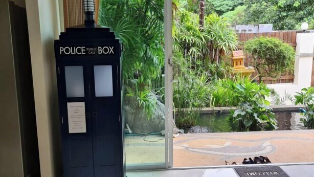 A police public box and a welcome mat outside a building. - ViewPoint Villa (Phuket)