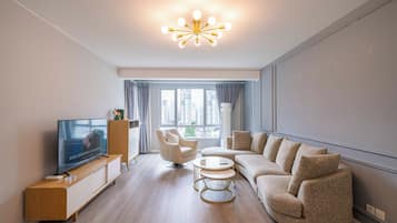 Superior Apartment, 2 Bedrooms, Kitchen, City View | Living room | 55-inch Smart TV with cable channels