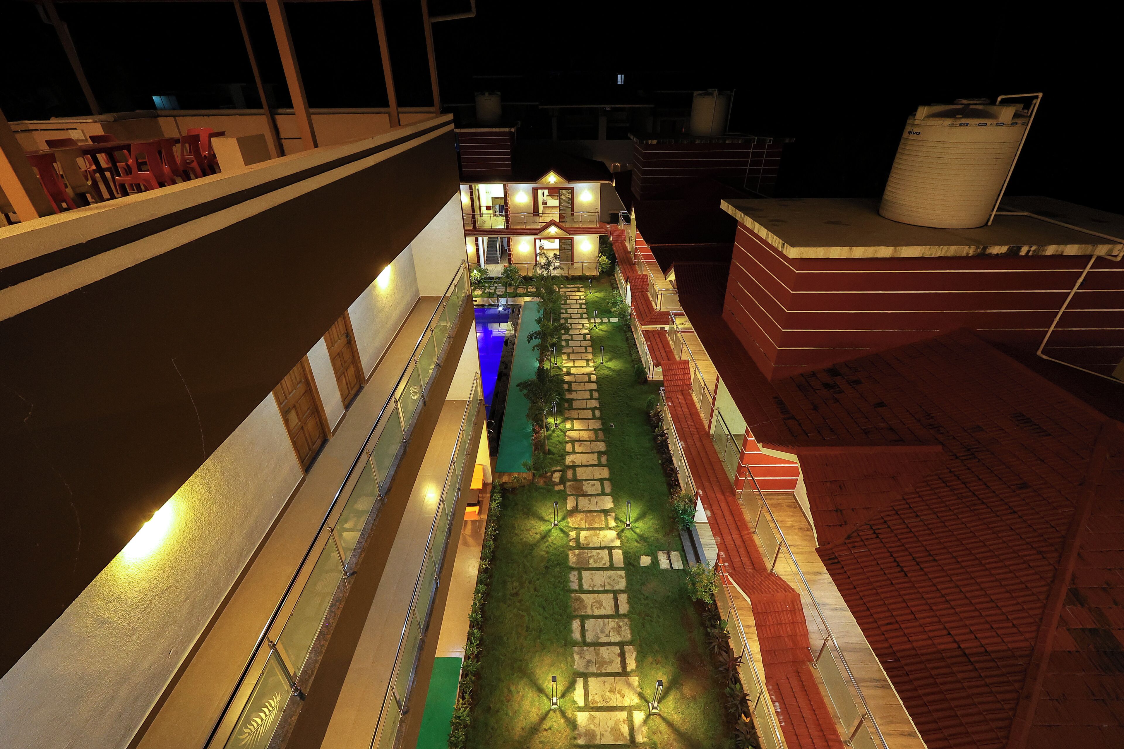 A model of a building with multiple levels, a central courtyard, and a staircase.
