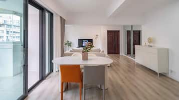 Superior Apartment, 2 Bedrooms, City View | Living room | 55-inch Smart TV with cable channels
