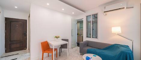 Superior Apartment, 1 Bedroom, Microwave, City View | Living room | 55-inch Smart TV with cable channels