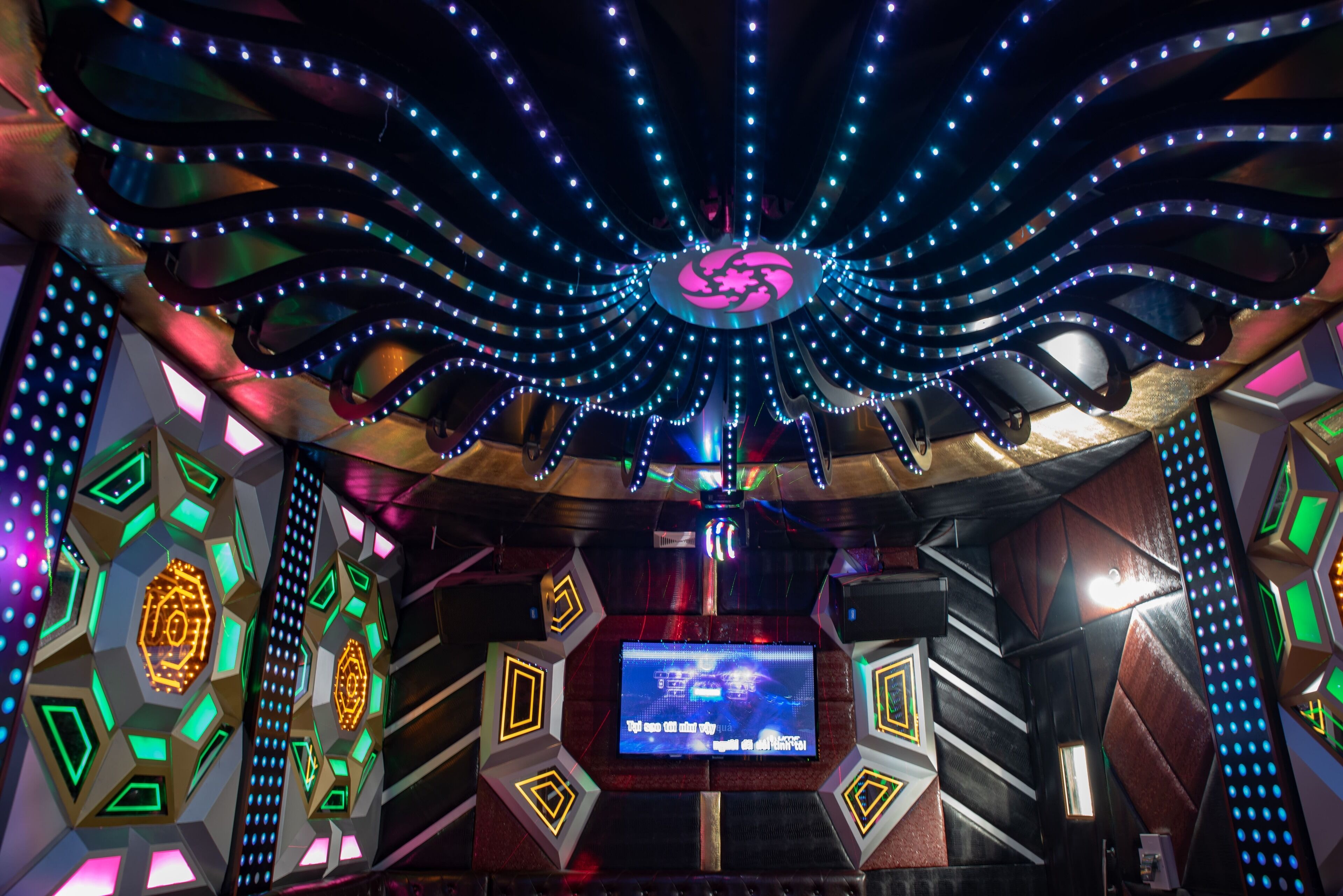 A modern interior with geometric patterns and LED lighting.