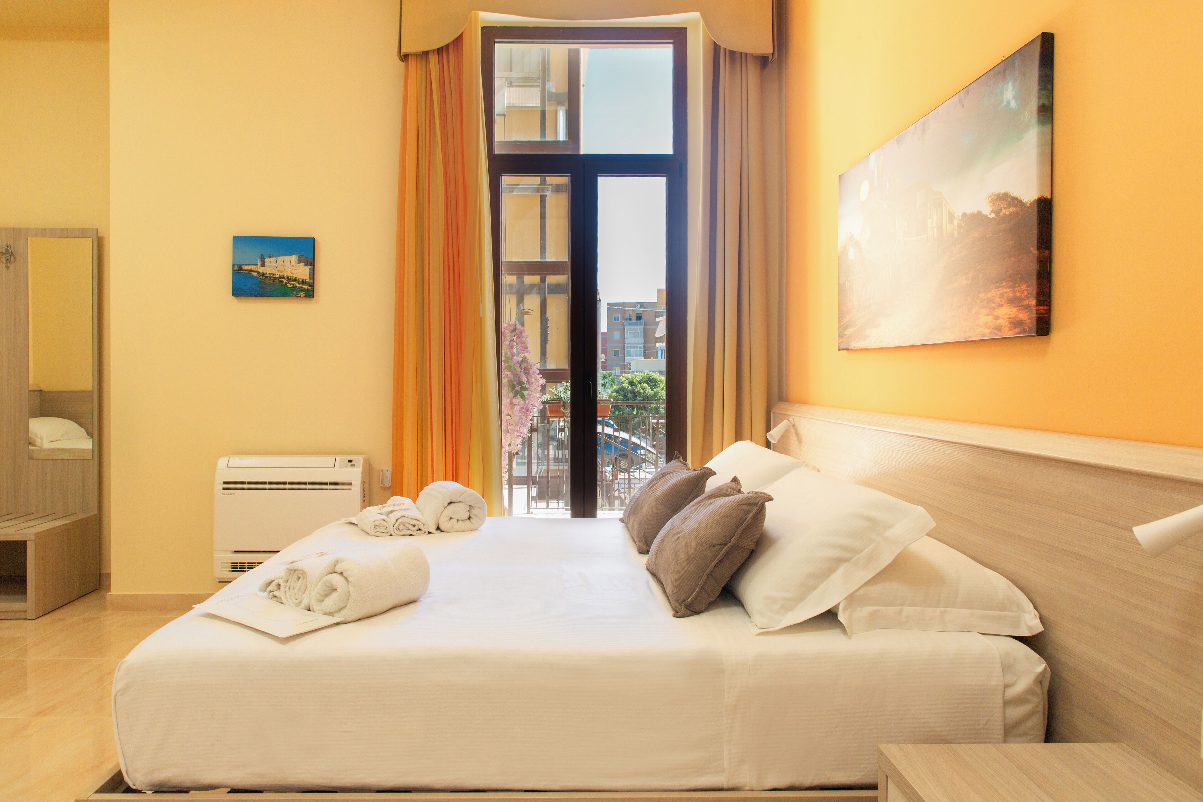 Deluxe Triple Room, Balcony | Minibar, in-room safe, desk, iron/ironing board