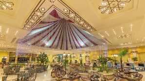 A spacious lobby with a large seating area, a decorative ceiling, and a central fountain. - Ali Baba Palace Resort - Families and Couples Only  (Hurghada)