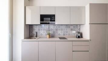 Basic Studio, 1 Queen Bed | Private kitchen | Fridge, microwave, oven, stovetop