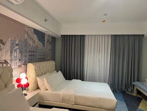 Deluxe Apartment, Balcony, City View | In-room safe, individually decorated, desk, laptop workspace - Luxurious European Style Modern Apartment Cross City of Dreams OKADA SOLAIRE MOA Airport (Paranaque)