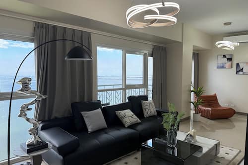 Luxury Apartment, Balcony, Sea View | Living area | 55-inch flat-screen TV with digital channels, Netflix