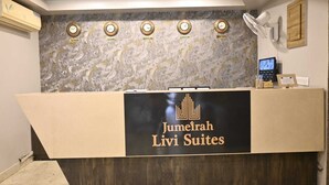 A reception desk with clocks indicating time in Riyadh, Dubai, Bangalore, London, and New York. - ZIPP Lite Frazer Town  (Bengaluru)