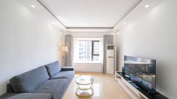 Superior Apartment, 2 Bedrooms, City View | Living room | 55-inch Smart TV with cable channels