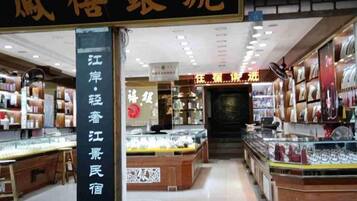 A jewelry store interior with display cases and shelves of jewelry.