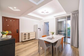 Superior Apartment, Balcony, City View | Living room | 55-inch Smart TV with cable channels