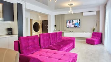 140-inch flat-screen TV with cable channels