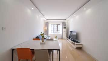 Superior Apartment, 2 Bedrooms, Kitchen, City View | Living room | 55-inch Smart TV with cable channels
