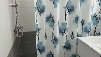 Shower, towels, soap, toilet paper