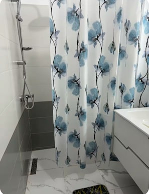 Shower, towels, soap, toilet paper