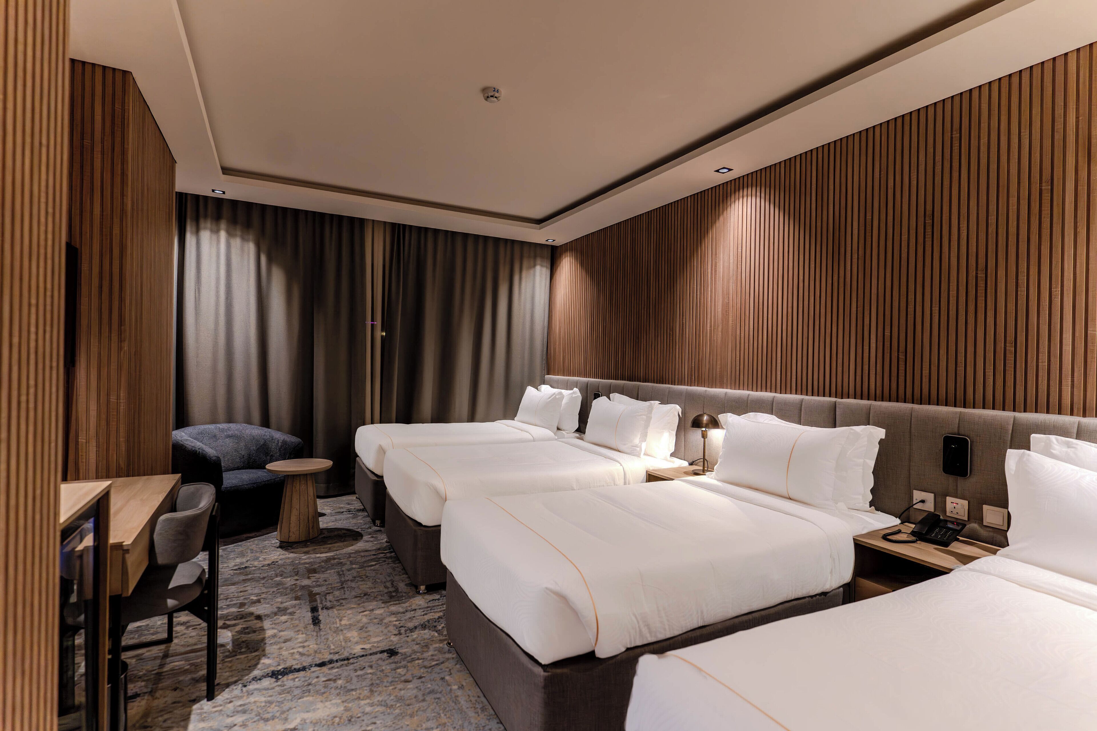 Deluxe Quadruple Room, City View | In-room safe, desk, blackout drapes, iron/ironing board