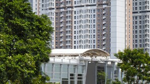 A high-rise building with multiple balconies and a prominent sign reading "Golden Tulip." - Hotel Golden Tulip Essential PIK2 Jakarta (Teluknaga)