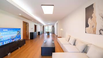 Apartment, 3 Bedrooms, Kitchen, City View | Living room | 55-inch Smart TV with cable channels