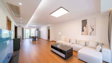 Apartment, 3 Bedrooms, Kitchen, City View | Living room | 55-inch Smart TV with cable channels