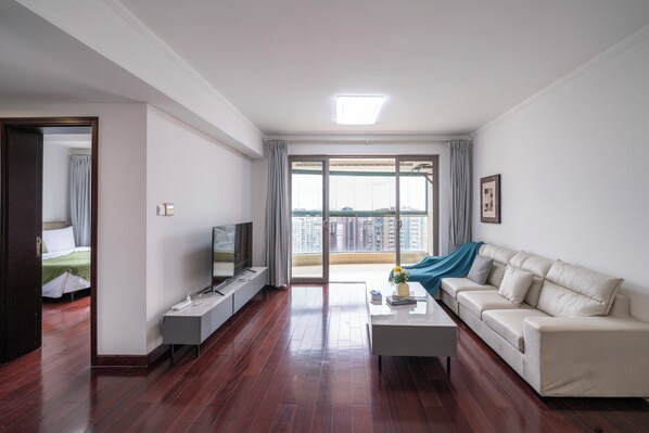 Superior Apartment, 2 Bedrooms, Kitchen, City View | Living room | 55-inch Smart TV with cable channels