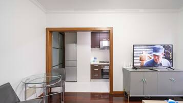 Superior Apartment, 1 Bedroom, Kitchen, City View | Living room | 55-inch Smart TV with cable channels