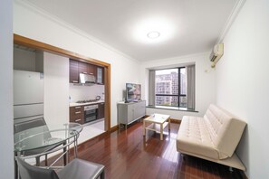 Superior Apartment, 1 Bedroom, Kitchen, City View | Living room | 55-inch Smart TV with cable channels