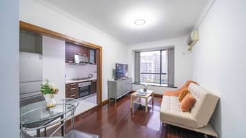 Superior Apartment, 1 Bedroom, Kitchen, City View | Living room | 55-inch Smart TV with cable channels