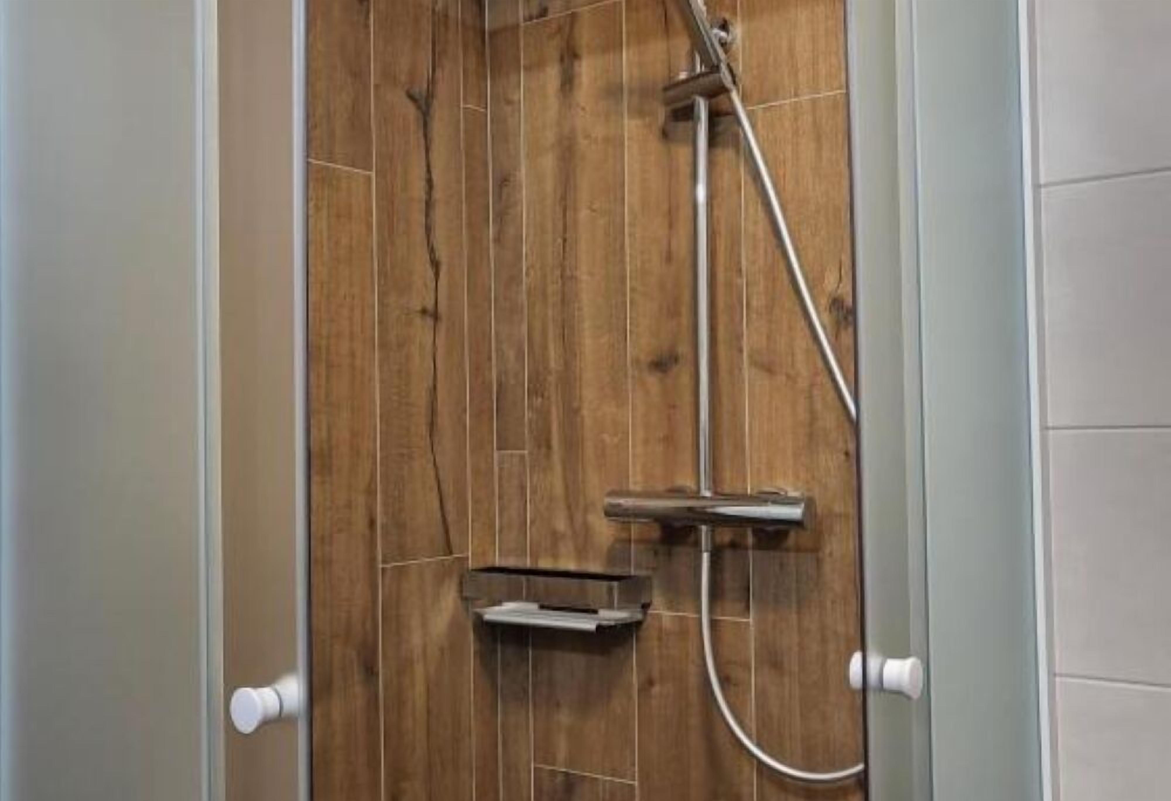Shower, hair dryer, towels, toilet paper
