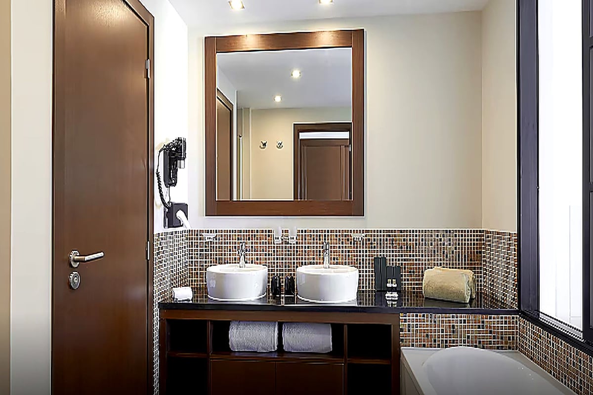 Bathroom | Hair dryer, bathrobes, slippers, towels