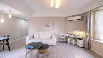 Superior Apartment, 1 Bedroom, Kitchen, City View | Living room | 55-inch Smart TV with cable channels