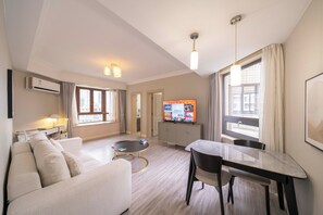 Superior Apartment, 1 Bedroom, Kitchen, City View | Living room | 55-inch Smart TV with cable channels - Tyms 1BR APT Gubei International Garden (Shanghai)