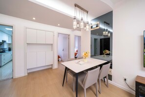 Superior Apartment, 3 Bedrooms, Kitchen, City View | Living room | 55-inch Smart TV with cable channels