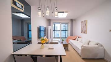 Superior Apartment, 3 Bedrooms, Kitchen, City View | Living room | 55-inch Smart TV with cable channels