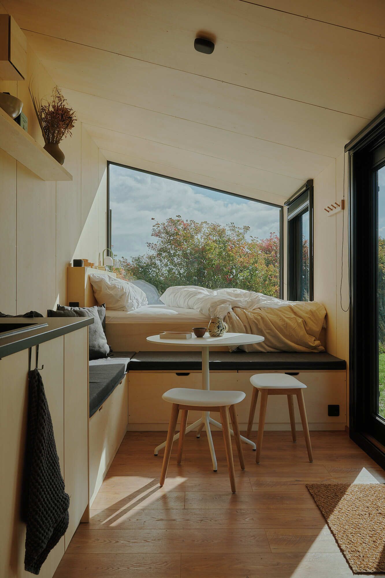 Raus | Cabins with field view + sauna access | Laptop workspace, blackout drapes, free WiFi, bed sheets