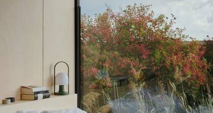 Raus | Cabins mit Feldblick + Saunazugang