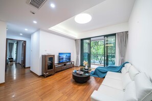 Superior Apartment, 3 Bedrooms, Kitchen, City View | Living room | 55-inch Smart TV with cable channels