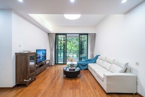 Superior Apartment, 3 Bedrooms, Kitchen, City View | Living room | 55-inch Smart TV with cable channels