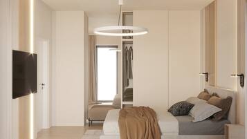 Un dormitorio moderno con una cama grande, un televisor y un armario.