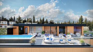 Un espace de détente extérieur moderne, doté d’une piscine, de chaises longues et d’un coin salon offrant une vue sur le ciel.