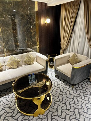 Executive Suite | Living area | 32-inch LED TV with digital channels