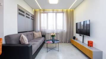 Superior Apartment, 1 Bedroom | Living area | 50-inch flat-screen TV with cable channels