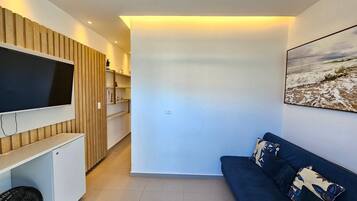 Apartamento Deluxe | Zona de estar